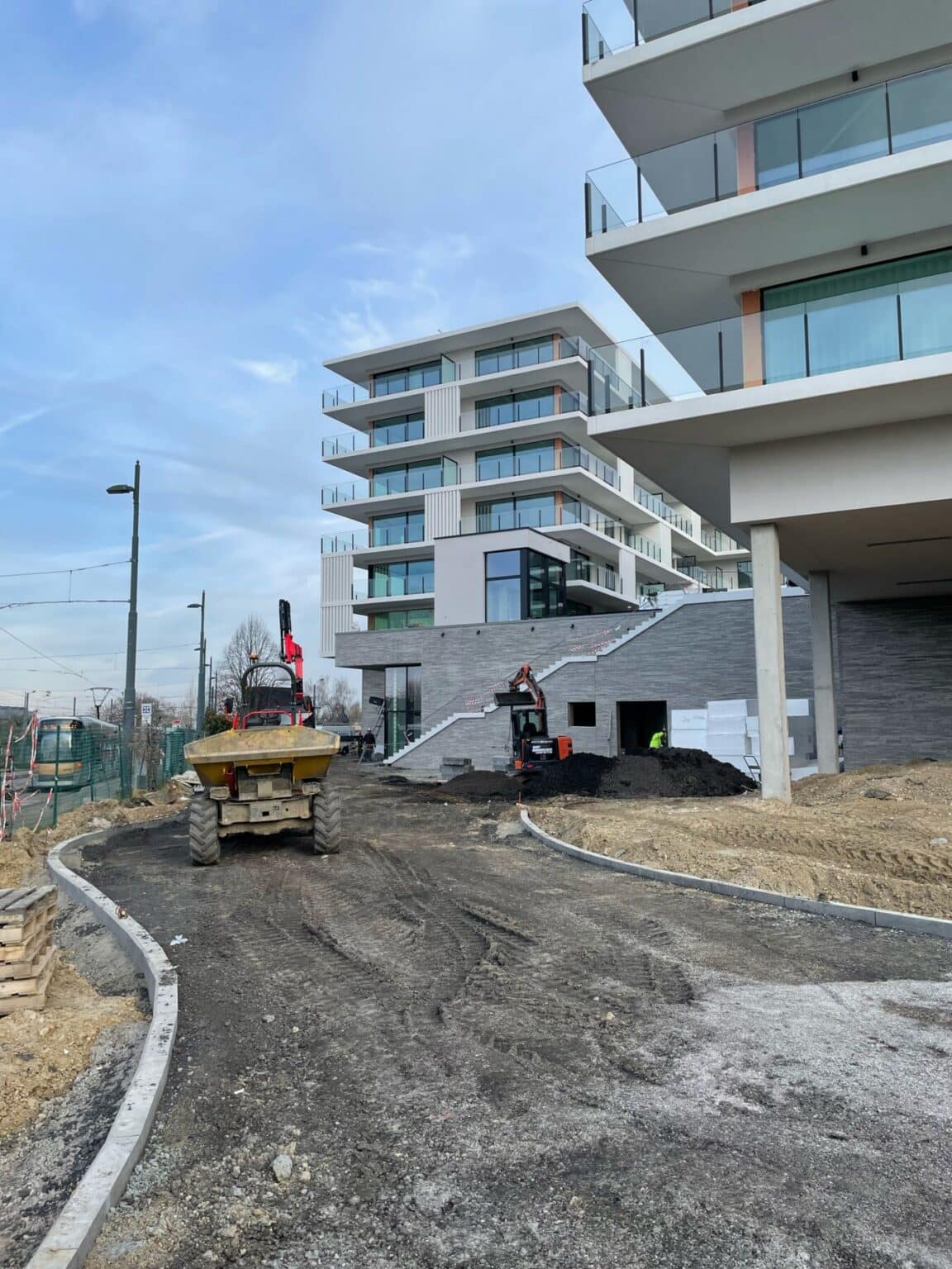 Dumper on the new road surface at the Emerald Garden residential building in Uccle, during the works